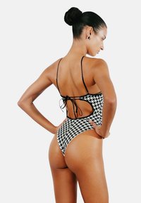 Perilla HEARTBREAKER - Jednodílné plavky - black