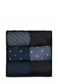 Sechs Paar Socken in einer schwarzen Box: Die Muster umfassen Rauten, Pünktchen und geometrische Formen. Die Farben sind dunkelblau, schwarz und grau.