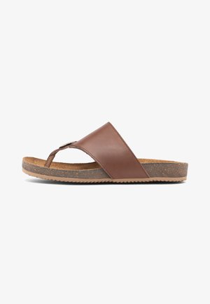 Sandale homme en cuir marron avec semelle en liège et semelle extérieure en caoutchouc texturé, conçue pour un usage décontracté.