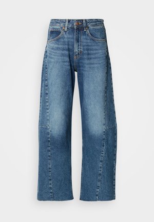 Helle blaue Denim-Jeans mit weitem Bein und hoher Taille, ausgestattet mit Fronttaschen und kontrastierenden Nähten. Geschmeidige Textur mit lockerer Passform.