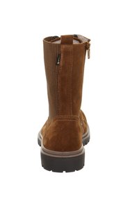 Braune Wildleder-Stiefeletten mit strukturiertem Einsatz, seitlichem Reißverschluss und Gummisohle. Verfügen über ein robustes Design und verstärkte Nähte.