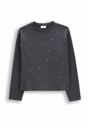 Czarny, prążkowany sweter z długim rękawem, z małymi, białymi ozdobnymi ćwiekami rozmieszczonymi na przodzie. Okrągły dekolt, krótki fason.