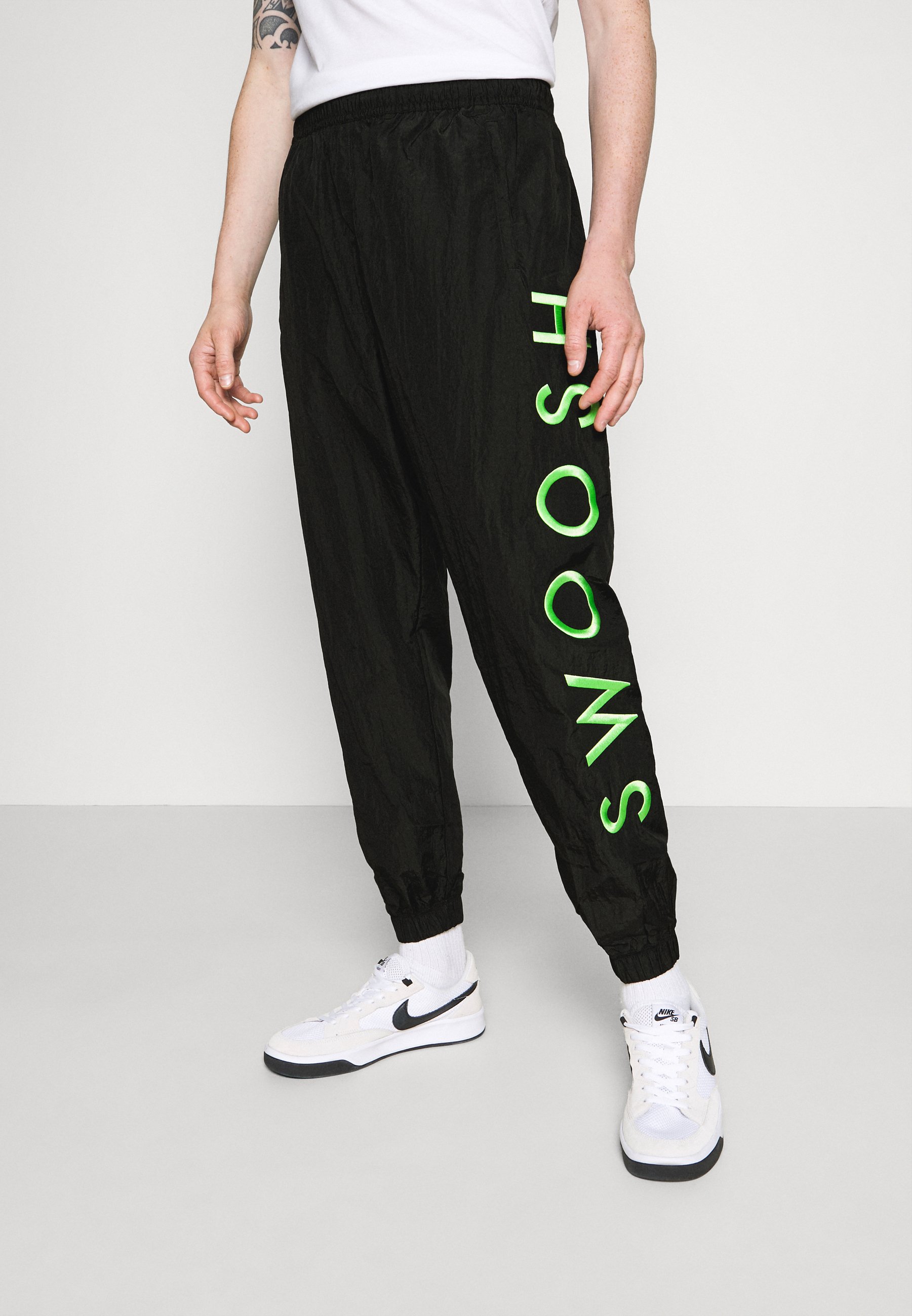 nike tracksuit bottoms green