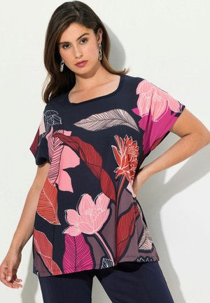 Navy floral blouse features pink and red flower prints and leaves, short sleeves, a round neckline, and a loose, flowing design.