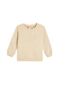 Sudadera de color beige claro hecha de una tela suave, con un diseño texturizado de dinosaurio en el frente, puños y dobladillo acanalados.