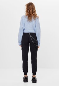 Bershka Tygbyxor - black