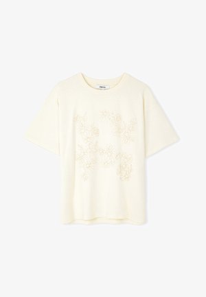 Crème korte mouwen t-shirt met een geborduurd bloemenontwerp in lichtbeige. Ronde hals, relaxte pasvorm, zachte textuur en gladde stof.
