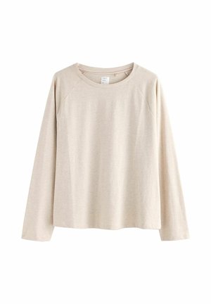 Beige long-sleeve t-shirt made of soft fabric with a crew neck and raglan sleeves, featuring a smooth texture and minimal design.
