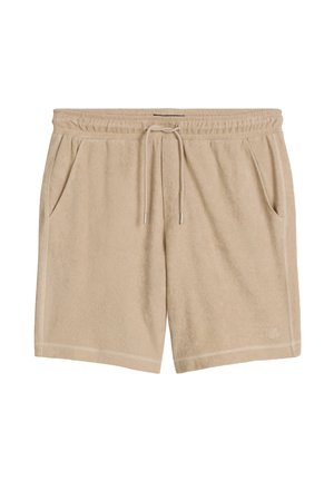 Beige Frottee-Shorts mit elastischem Bund, verstellbarem Kordelzug, Seitentaschen und dezenter Logoapplikation am Saum vor weißem Hintergrund.