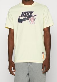 Nike Sportswear Triko s potiskem - off-white