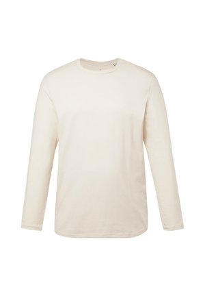 T-shirt a maniche lunghe in un morbido tessuto beige. Collo rotondo, vestibilità regolare e texture liscia senza motivi o dettagli.