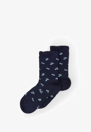 Calze navy con bordo a coste, caratterizzate da un motivo floreale sparso in azzurro chiaro e verde. Realizzate in un materiale morbido e elastico.