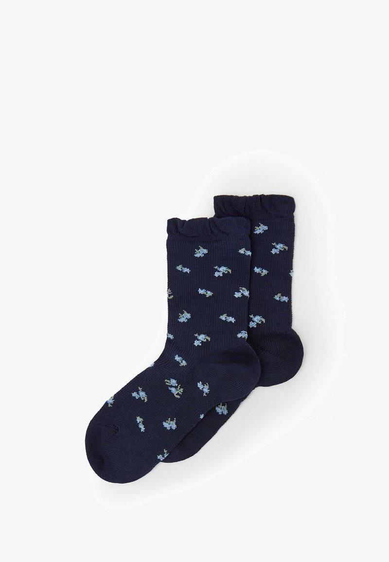 Calze navy con bordo a coste, caratterizzate da un motivo floreale sparso in azzurro chiaro e verde. Realizzate in un materiale morbido e elastico.