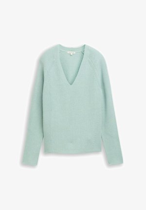 Lyse mintgrøn strikket sweater med V-hals, lange ærmer og en struktureret overflade. Har en afslappet pasform og sideslidser ved kanten.