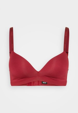 Rød, sømløs bh med trekantet form og myk, elastisk stoff. Har logo-trykte stropper og hakeåpning på baksiden.
