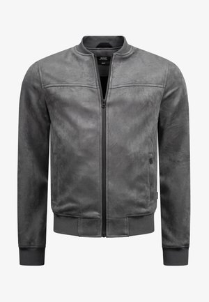 Giacca bomber grigia realizzata in un tessuto morbido e liscio, con zip frontale, polsini e orlo a costine. Presenta eleganti dettagli delle cuciture e tasche laterali.