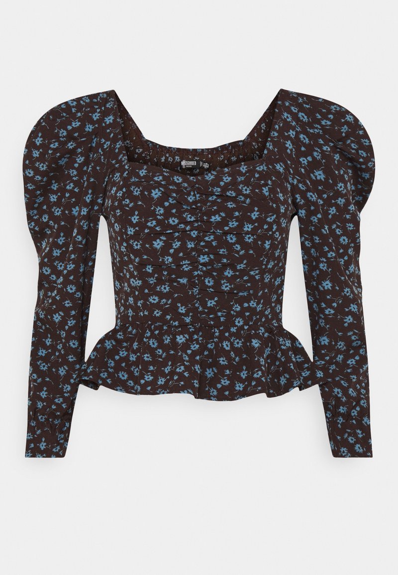 Haut péplum marron à fleurs avec manches longues bouffantes, présentant un corsage froncé et de petits motifs de fleurs bleues partout.