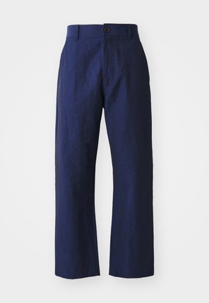 Navy blue linen trousers with a loose fit, straight legs, front button closure, and subtle texture. Clean design, no embellishments.