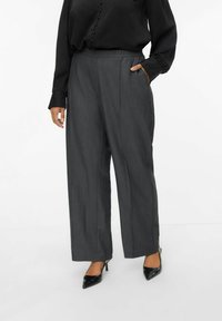 Gray wide-leg trousers with an elastic waistband, featuring side pockets, and a smooth texture. Paired with black pointed-toe heels.