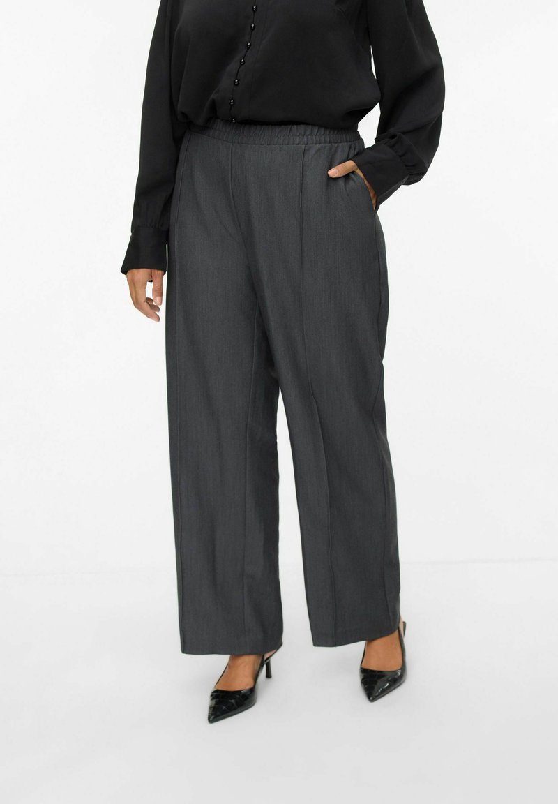 Gray wide-leg trousers with an elastic waistband, featuring side pockets, and a smooth texture. Paired with black pointed-toe heels.