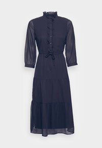 Tmavě modré midi šaty s volánovým límečkem, knoflíkovou přední částí a dlouhými průhlednými rukávy. Mají zavazování v pase a skládanou sukni.