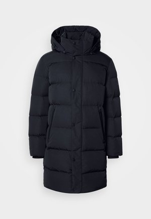 Manteau rembourré noir avec capuche, présentant un design matelassé, des boutons-pression et des poches zippées. Fabriqué en tissu lisse et léger.