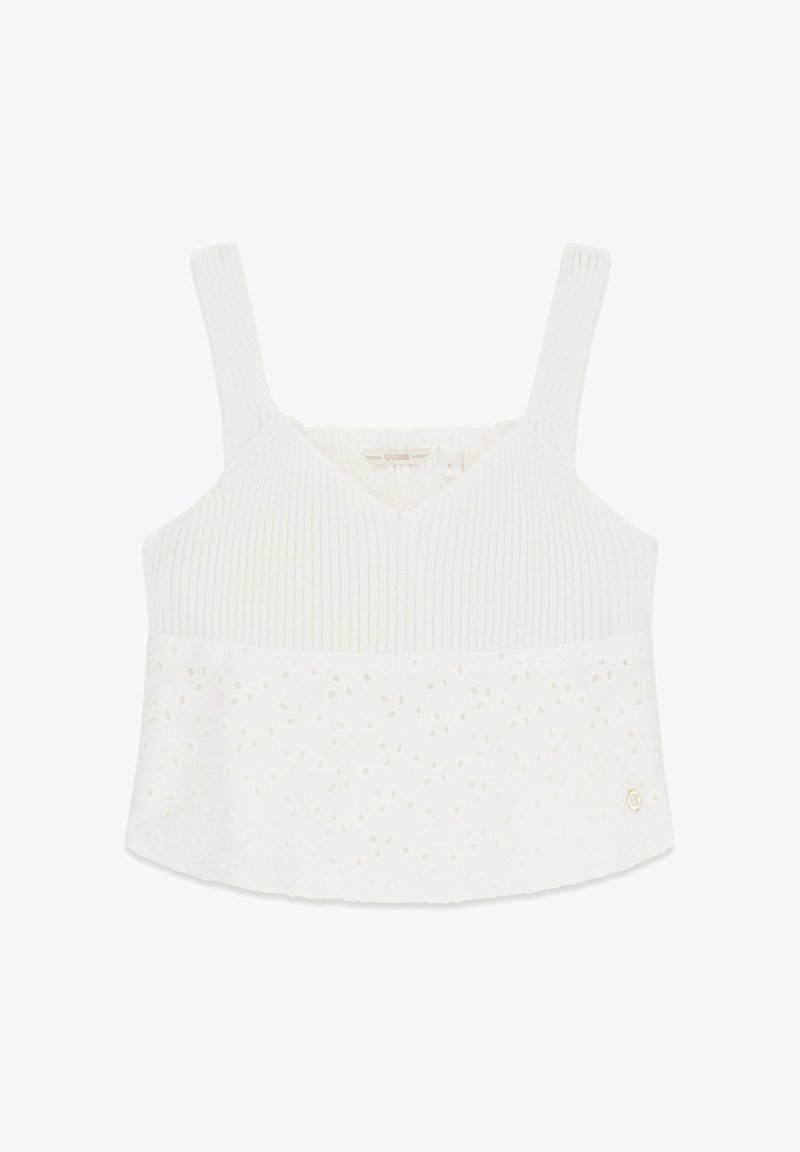Haut court blanc sans manches en côte, avec détail en dentelle à œillets sur la moitié inférieure et fines bretelles.