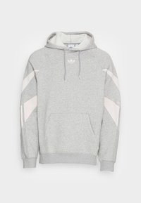 Grå hoodie i mjukt tyg, med framficka, justerbar dragkedja i huvan och rosa snedställda detaljer på ärmarna.