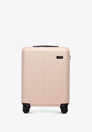Compact beige harde koffer met vier zwarte spinnerwielen en een zwarte handgreep, voorzien van een Wittchen logo-plaatje.