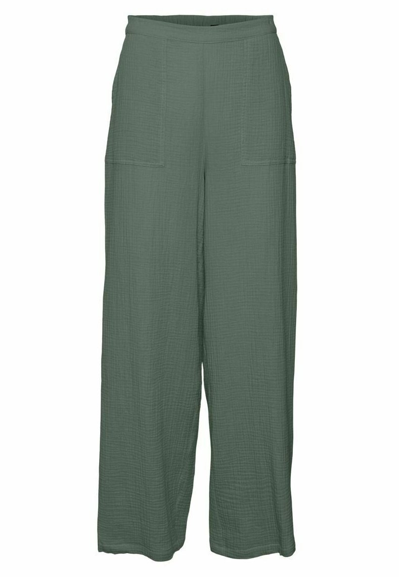 Pantalon ample vert foncé à taille haute avec grandes poches plaquées sur le devant, fabriqué en tissu texturé.