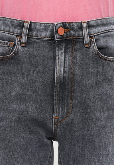 Gray denim jeans with orange stitching accents, button closure, and classic five-pocket design. Smooth texture, mid-rise fit observed.