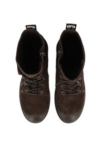 Brown suede ankle boots with metal eyelets, laces, and side zippers. Rounded toe design with textured leather accents.