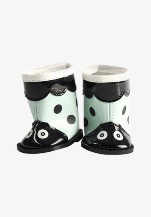 Regenlaarzen voor peuters met zwart-witte stippen, zwarte geschulpte rand en ogen bedrukt op de tenen.