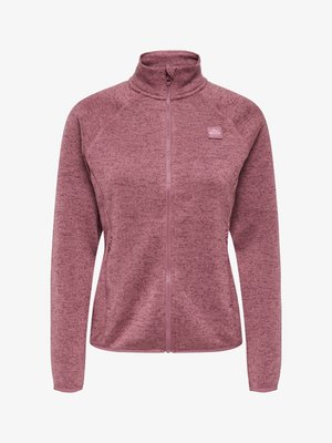 Täisvalge lukuga naiste fliisjakkk helihallikas lilla toonis, kõrge kaelusega, pikkade varrukatega, küljetaskutega ning väikese logoplaastriga rinnal.