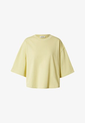 Lichtgeel oversized katoenen T-shirt met korte mouwen, ronde hals en wijde mouwen, met het label "EDITED" aan de binnenkant van de kraag.