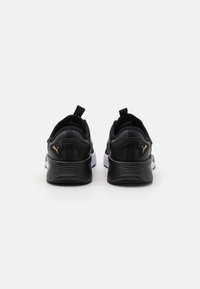 Puma Chaussures de running sur route - gold-coloured