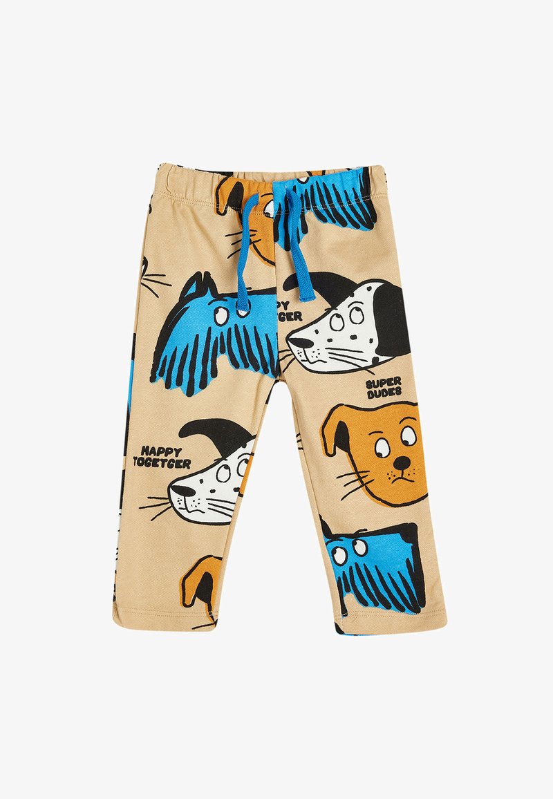 Beige kinderbroek met kleurrijke hondenpatronen in blauw, zwart en oranje. Beschikt over een elastische tailleband met een blauwe trekkoord.