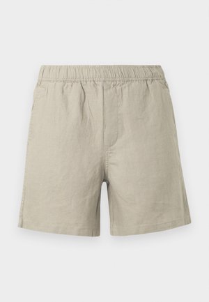 Helle beigefarbene Leinen-Shorts mit elastischem Bund, ausgestattet mit einem geraden Schnitt und seitlichen Nahtdetails. Glatte, atmungsaktive Textur.