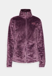Plommonlila mjuk fleecejacka med full frontdragkedja, hög krage, långa ärmar och The North Face-logotyp på bröstet.