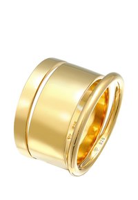 Anello in tono oro con un design liscio e arrotondato, composto da due bande intrecciate e un marchio di metallo 925 all'interno.