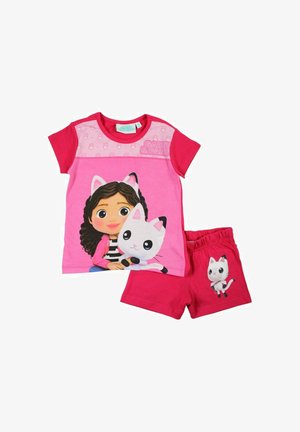 Ensemble deux pièces en coton rose comprenant un t-shirt avec un graphique représentant une fille et un chat, assorti à un short rose uni avec un motif de chat.