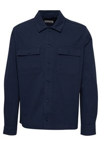 Chemise bleu marine avec col, fermeture à boutons sur le devant, et deux poches poitrine. Fabriquée en tissu uni avec une texture lisse.