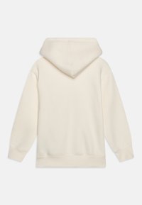 Kremfarget hettegenser laget av myk stoff, med hette, lange ermer og ribbede mansjetter og hem. Glatt tekstur, minimalistisk design.
