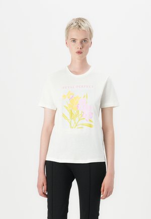 White cotton t-shirt featuring a floral graphic print in pink, yellow, and green, with the text "PETAL PERFECT" above the design.