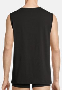 Black sleeveless t-shirt made of soft fabric, featuring a round neckline and a relaxed fit, with visible stitching along the edges.