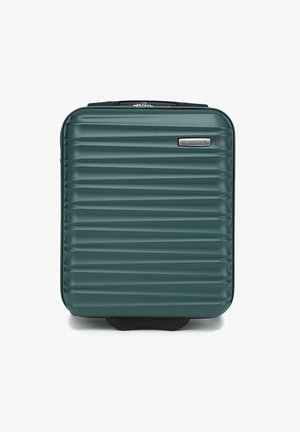 Valise rigide de couleur vert foncé avec un motif strié texturé. Dotée d'une fermeture éclair lisse et d'une poignée élégante sur le dessus. Design compact.