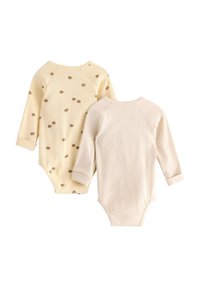 Dwa body z długim rękawem: jedno w miękkim żółtym kolorze z brązowymi kropkami, drugie w jednolitym jasnobeżowym, z żeberkowaną fakturą i zapięciami na zatrzaski.