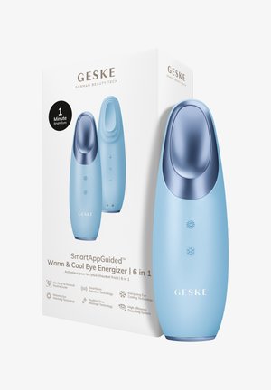Appareil énergisant pour les yeux GESKE bleu chaud et froid avec icônes de soleil et de flocon de neige, présenté à côté de sa boîte produit blanche.