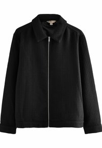 Zwarte zip-up jack van een gestructureerde stof, met kraagontwerp, lange mouwen en een rechte snit. Voorzien van een centrale rits afsluiting.