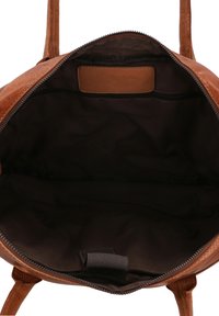 Brown leather backpack with a zip closure, featuring a dark lining, interior pocket, and textured surface. Sturdy shoulder straps included.